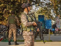 Indian security personnel stand near the site of a grenade blast at a marketplace in Srinagar, Jammu and Kashmir, on November 3, 2024. At le...