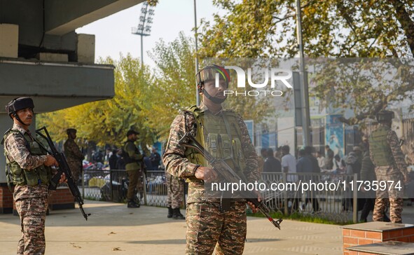 Indian security personnel stand near the site of a grenade blast at a marketplace in Srinagar, Jammu and Kashmir, on November 3, 2024. At le...