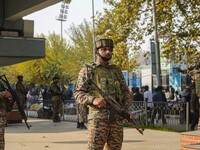 Indian security personnel stand near the site of a grenade blast at a marketplace in Srinagar, Jammu and Kashmir, on November 3, 2024. At le...