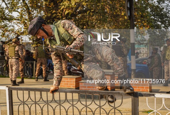 Indian security personnel inspect the site of a grenade blast at a marketplace in Srinagar, Jammu and Kashmir, on November 3, 2024. At least...