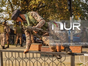 Indian security personnel inspect the site of a grenade blast at a marketplace in Srinagar, Jammu and Kashmir, on November 3, 2024. At least...