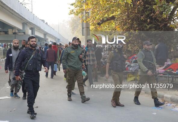 Indian security personnel inspect the site of a grenade blast at a marketplace in Srinagar, Jammu and Kashmir, on November 3, 2024. At least...