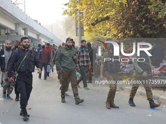 Indian security personnel inspect the site of a grenade blast at a marketplace in Srinagar, Jammu and Kashmir, on November 3, 2024. At least...