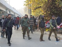 Indian security personnel inspect the site of a grenade blast at a marketplace in Srinagar, Jammu and Kashmir, on November 3, 2024. At least...