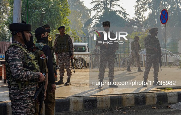 Indian security personnel stand near the site of a grenade blast at a marketplace in Srinagar, Jammu and Kashmir, on November 3, 2024. At le...