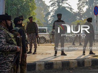 Indian security personnel stand near the site of a grenade blast at a marketplace in Srinagar, Jammu and Kashmir, on November 3, 2024. At le...