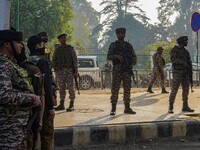 Indian security personnel stand near the site of a grenade blast at a marketplace in Srinagar, Jammu and Kashmir, on November 3, 2024. At le...