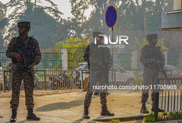 Indian security personnel stand near the site of a grenade blast at a marketplace in Srinagar, Jammu and Kashmir, on November 3, 2024. At le...