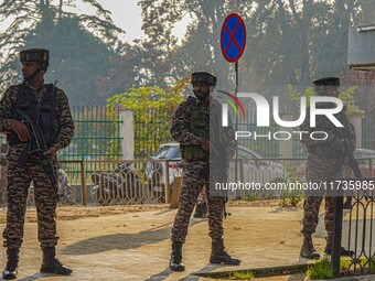 Indian security personnel stand near the site of a grenade blast at a marketplace in Srinagar, Jammu and Kashmir, on November 3, 2024. At le...