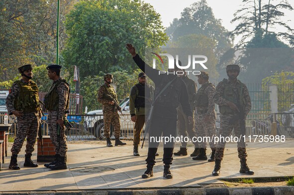 Indian security personnel stand near the site of a grenade blast at a marketplace in Srinagar, Jammu and Kashmir, on November 3, 2024. At le...