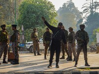 Indian security personnel stand near the site of a grenade blast at a marketplace in Srinagar, Jammu and Kashmir, on November 3, 2024. At le...