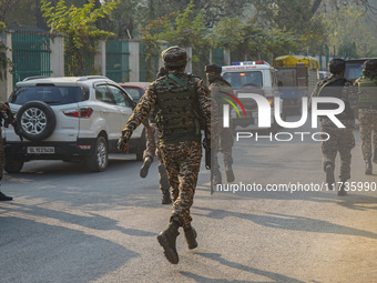 Indian security personnel run towards the site of a grenade blast at a marketplace in Srinagar, Jammu and Kashmir, on November 3, 2024. At l...