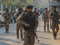 Indian security personnel inspect the site of a grenade blast at a marketplace in Srinagar, Jammu and Kashmir, on November 3, 2024. At least...