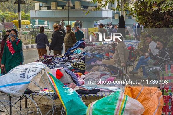 Street vendors wait for customers after a grenade blast at a marketplace in Srinagar, Jammu and Kashmir, on November 3, 2024. At least ten p...