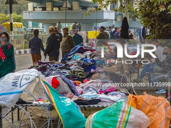 Street vendors wait for customers after a grenade blast at a marketplace in Srinagar, Jammu and Kashmir, on November 3, 2024. At least ten p...