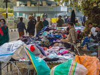 Street vendors wait for customers after a grenade blast at a marketplace in Srinagar, Jammu and Kashmir, on November 3, 2024. At least ten p...