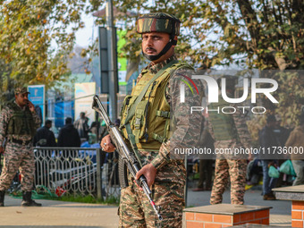 A security personnel stands near the site of a grenade blast at a marketplace in Srinagar, Jammu and Kashmir, on November 3, 2024. At least...