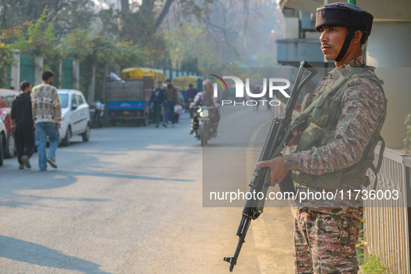 An Indian security personnel stands near the site of a grenade blast at a marketplace in Srinagar, Jammu and Kashmir, on November 3, 2024. A...