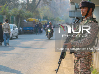 An Indian security personnel stands near the site of a grenade blast at a marketplace in Srinagar, Jammu and Kashmir, on November 3, 2024. A...