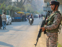 An Indian security personnel stands near the site of a grenade blast at a marketplace in Srinagar, Jammu and Kashmir, on November 3, 2024. A...