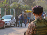 An Indian security personnel stands near the site of a grenade blast at a marketplace in Srinagar, Jammu and Kashmir, on November 3, 2024. A...