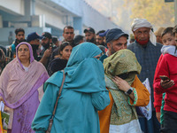 Civilians walk near the site of a grenade blast at a marketplace in Srinagar, Jammu and Kashmir, on November 3, 2024. At least ten people ar...