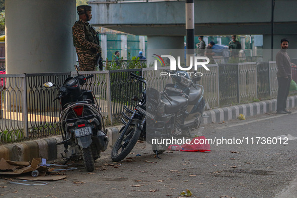 An Indian security personnel stands near the site of a grenade blast at a marketplace in Srinagar, Jammu and Kashmir, on November 3, 2024. A...