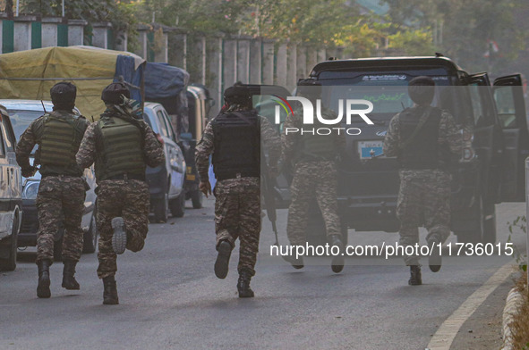 Indian security personnel run towards the site of a grenade blast at a marketplace in Srinagar, Jammu and Kashmir, on November 3, 2024. At l...