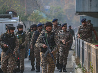 Indian security personnel inspect the site of a grenade blast at a marketplace in Srinagar, Jammu and Kashmir, on November 3, 2024. At least...