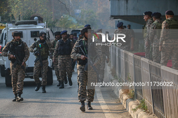 Indian security personnel inspect the site of a grenade blast at a marketplace in Srinagar, Jammu and Kashmir, on November 3, 2024. At least...