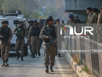 Indian security personnel inspect the site of a grenade blast at a marketplace in Srinagar, Jammu and Kashmir, on November 3, 2024. At least...