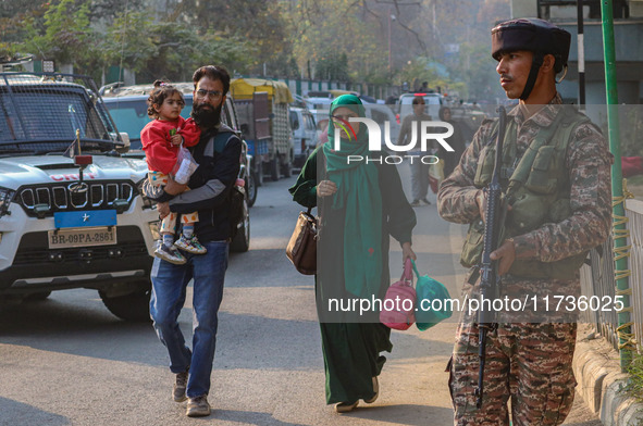 An Indian security personnel stands near the site of a grenade blast at a marketplace in Srinagar, Jammu and Kashmir, on November 3, 2024. A...