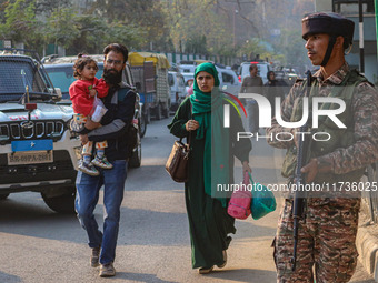 An Indian security personnel stands near the site of a grenade blast at a marketplace in Srinagar, Jammu and Kashmir, on November 3, 2024. A...