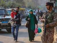 An Indian security personnel stands near the site of a grenade blast at a marketplace in Srinagar, Jammu and Kashmir, on November 3, 2024. A...