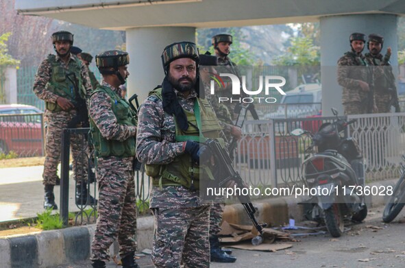 Indian security personnel stand near the site of a grenade blast at a marketplace in Srinagar, Jammu and Kashmir, on November 3, 2024. At le...