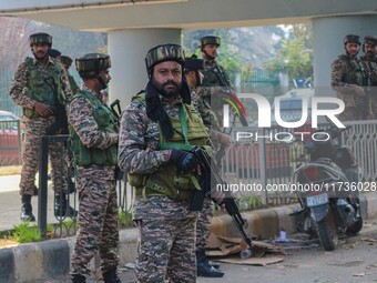 Indian security personnel stand near the site of a grenade blast at a marketplace in Srinagar, Jammu and Kashmir, on November 3, 2024. At le...