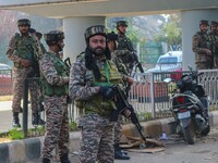 Indian security personnel stand near the site of a grenade blast at a marketplace in Srinagar, Jammu and Kashmir, on November 3, 2024. At le...