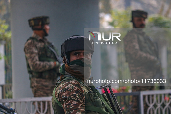 Indian security personnel stand near the site of a grenade blast at a marketplace in Srinagar, Jammu and Kashmir, on November 3, 2024. At le...