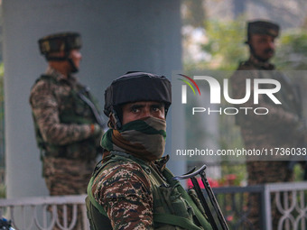 Indian security personnel stand near the site of a grenade blast at a marketplace in Srinagar, Jammu and Kashmir, on November 3, 2024. At le...