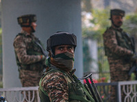 Indian security personnel stand near the site of a grenade blast at a marketplace in Srinagar, Jammu and Kashmir, on November 3, 2024. At le...