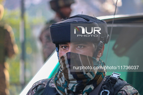 An Indian security personnel stands near the site of a grenade blast at a marketplace in Srinagar, Jammu and Kashmir, on November 3, 2024. A...