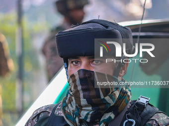 An Indian security personnel stands near the site of a grenade blast at a marketplace in Srinagar, Jammu and Kashmir, on November 3, 2024. A...