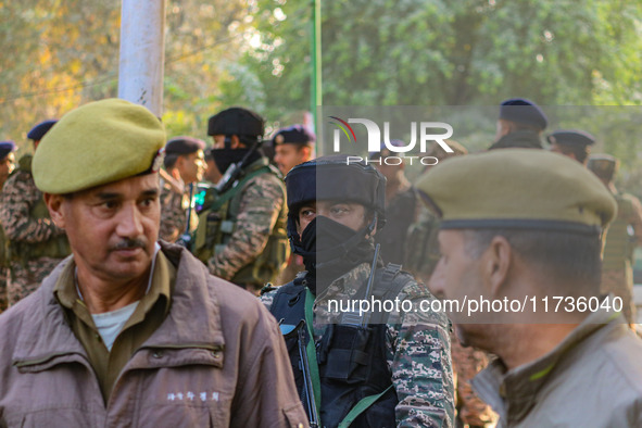 Indian security personnel stand near the site of a grenade blast at a marketplace in Srinagar, Jammu and Kashmir, on November 3, 2024. At le...