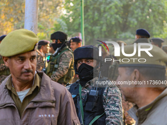 Indian security personnel stand near the site of a grenade blast at a marketplace in Srinagar, Jammu and Kashmir, on November 3, 2024. At le...