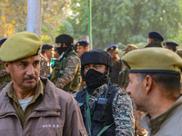 Indian security personnel stand near the site of a grenade blast at a marketplace in Srinagar, Jammu and Kashmir, on November 3, 2024. At le...