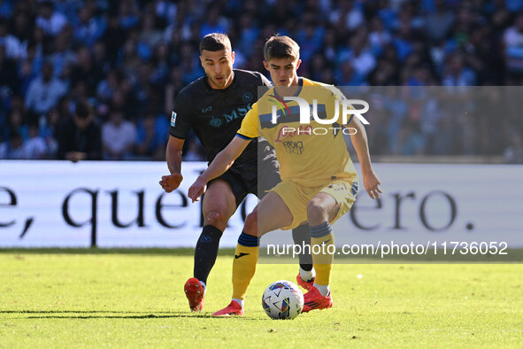 Alessandro Buongiorno of S.S.C. Napoli and Charles De Ketelaere of Atalanta B.C. are in action during the 11th day of the Serie A Championsh...