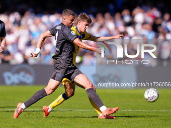 Alessandro Buongiorno of SSC Napoli and Charles De Ketelaere of Atalanta BC compete for the ball during the serie Serie A Enilive match betw...