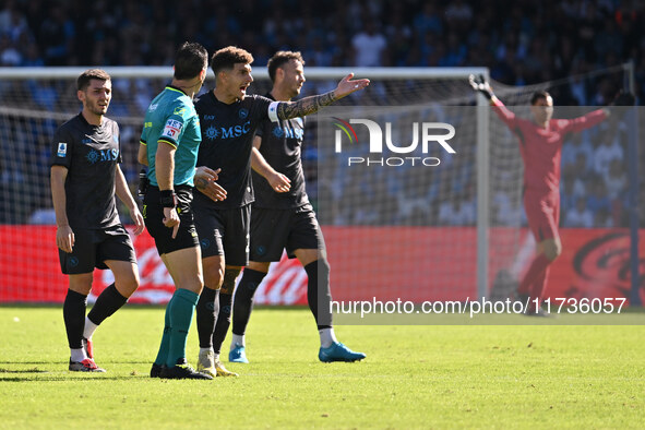 Referee Daniele Doveri and Giovanni Di Lorenzo of S.S.C. Napoli are present during the 11th day of the Serie A Championship between S.S.C. N...