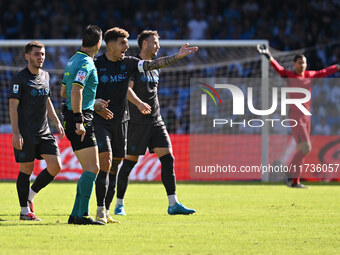 Referee Daniele Doveri and Giovanni Di Lorenzo of S.S.C. Napoli are present during the 11th day of the Serie A Championship between S.S.C. N...