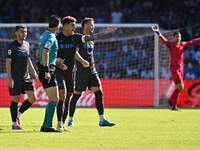 Referee Daniele Doveri and Giovanni Di Lorenzo of S.S.C. Napoli are present during the 11th day of the Serie A Championship between S.S.C. N...